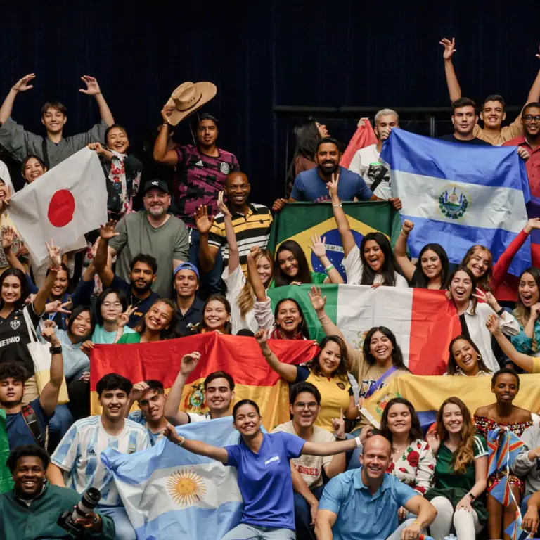 CFNI international scholarship students holding their nations’ flags